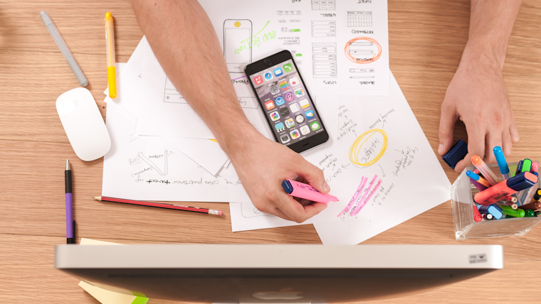 Person reviewing resume documents at a desk — resume improvement tips